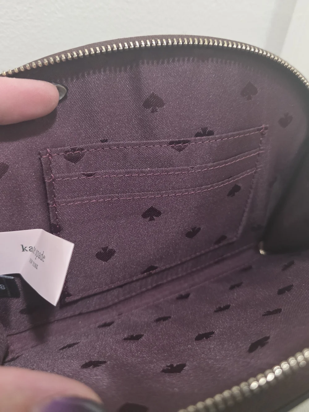 kate spade Pebbled Leather Wristlet in Deep Plum
